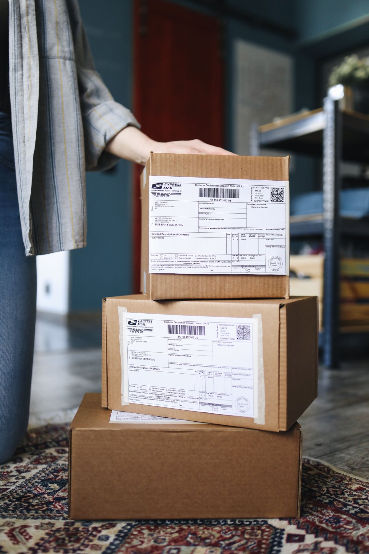 Stacked cardboard parcels with shipping labels